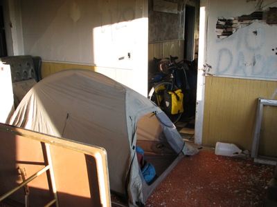 Camping inside a vacant house. Everything is trashed up, but it still provided shelter from possible wind, rain and unwanted visitors.